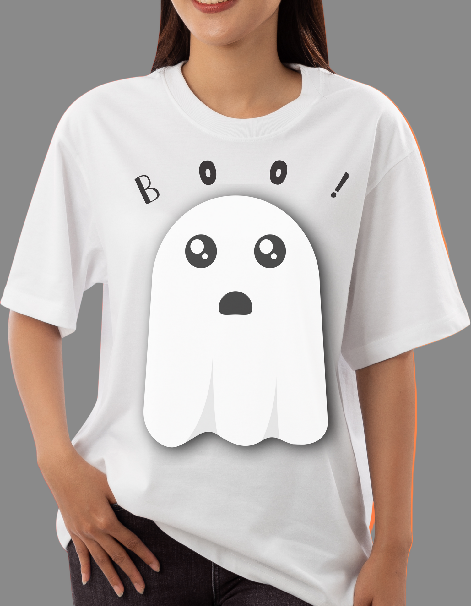 Person wearing a white t-shirt with a ghost graphic and 'BOO!' text on a red and orange gradient background